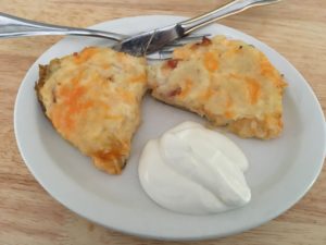 Stuffed Baked Potatoes Served up Hot with a scoop of sour cream